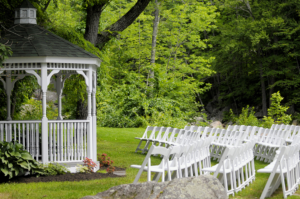 Gazebo with white chairs in front of it at the Wentworth.
