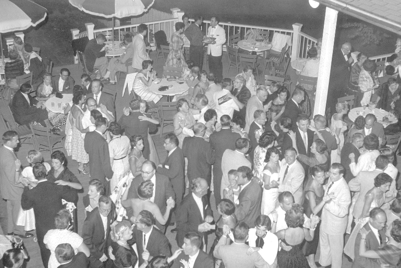 A black and white photo of a group of people dancing at the Wentworth outside.