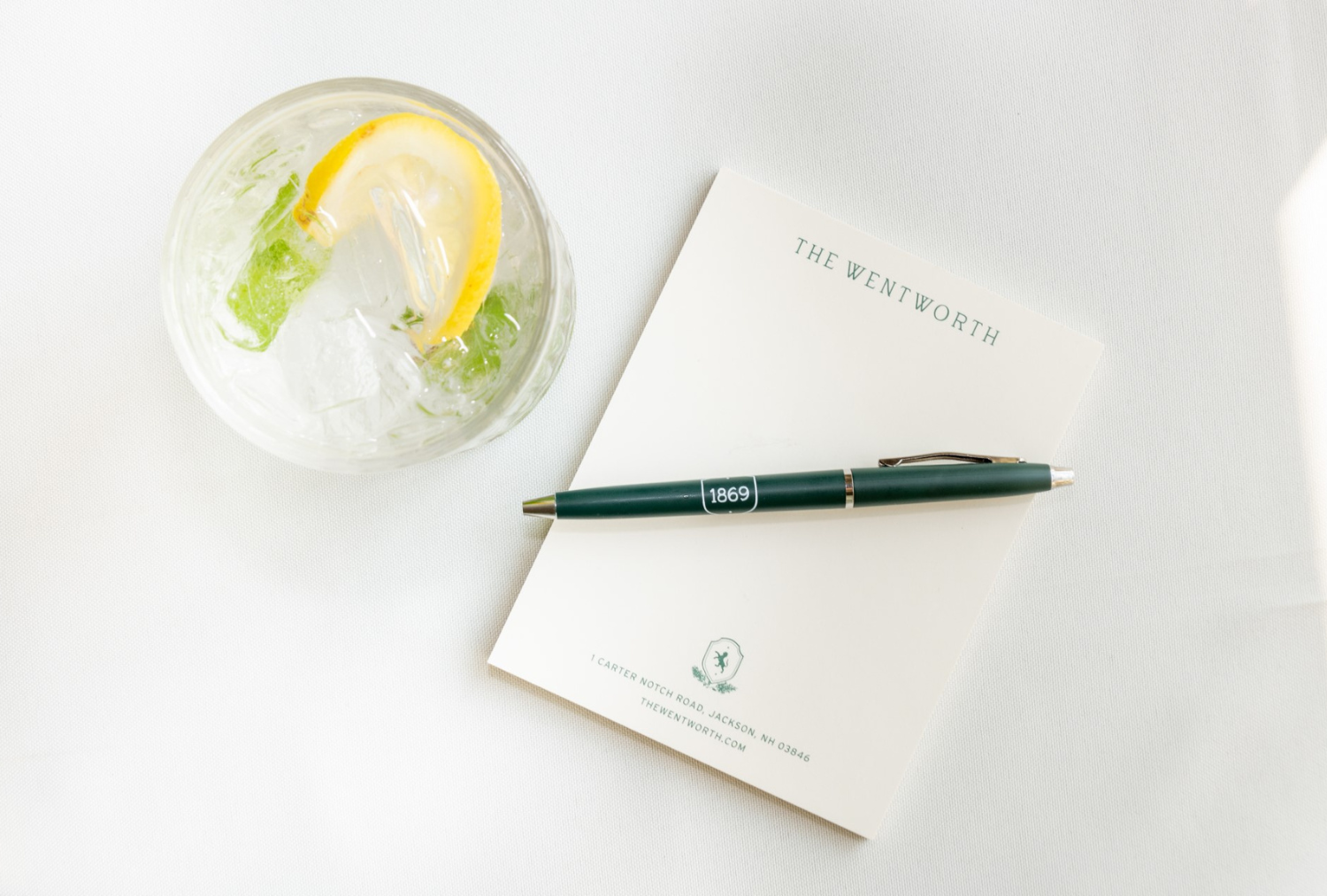 The Wentworth notepad with pen and drink
