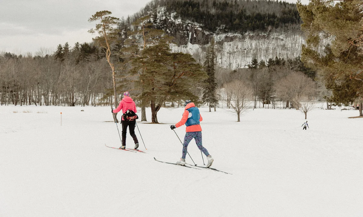 two women skiing in the Jackson, NH mountains