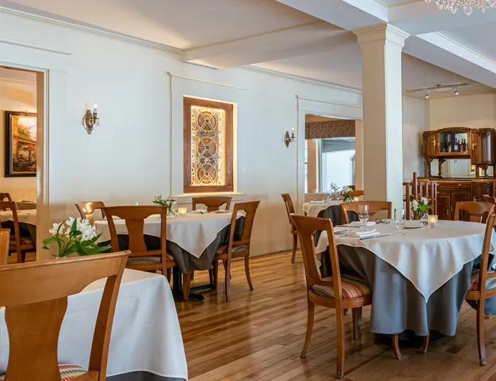 Dining tables with flowers and candles at the Wentworth.